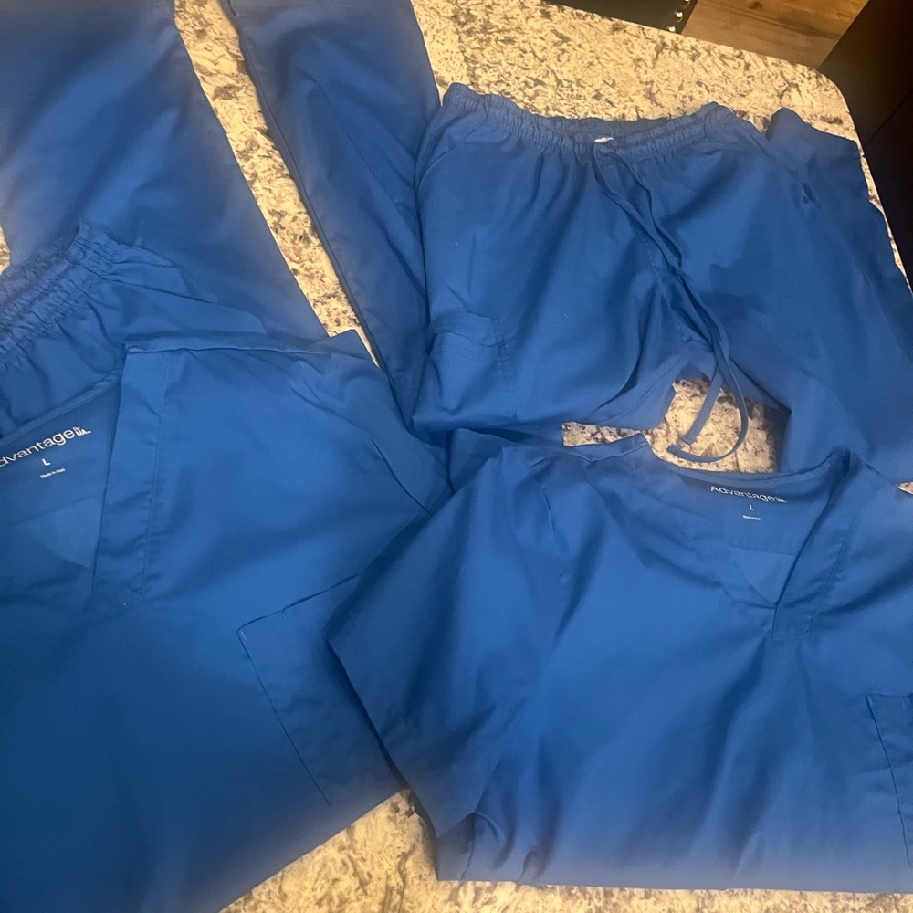2 sets of Royal blue man’s scrubs